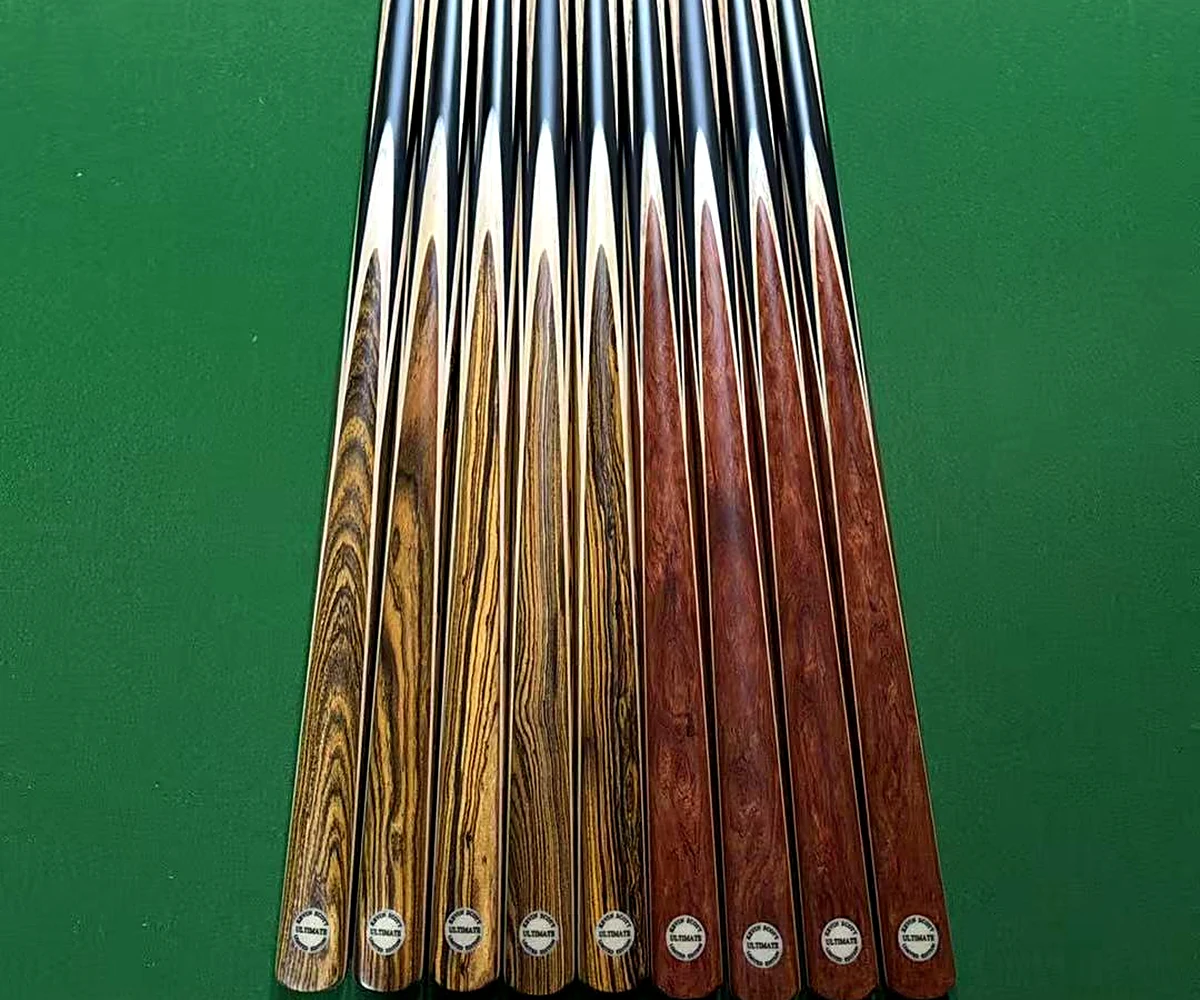 Rosewood and zebrano spliced cue butts on the bench at the SNOOKERCUE workshop